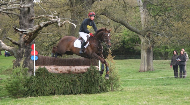 Chatsworth horse trials - horse and jockey jumping fence